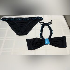 Victoria’s Secret Swim Suit Women’s Large Black with turquoise ruffle trim.